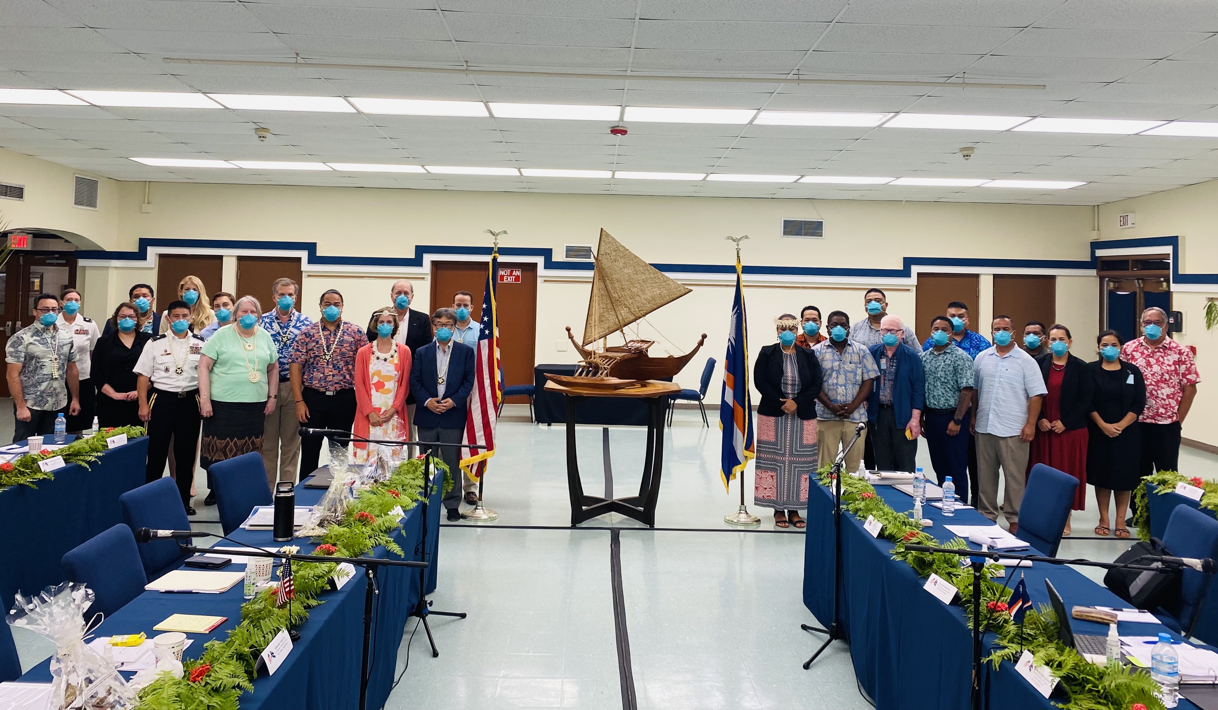 The first in-person negotiating session to renew provisions of a Compact of Free Association between the United States and the Marshall Islands took place at the U.S. Army base at Kwajalein June 14-16. U.S. Ambassador Joseph Yun is in the front of the U.S. negotiation team next to the U.S. flag, while Marshall Islands Foreign Minister Kitlang Kabua stands next to a Marshall Islands flag with her negotiation group.