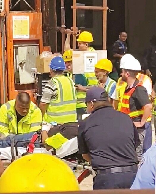 Emergency personnel attend to one of the injured workers at the IPI construction site, Friday, in Garapan. Contributed photo