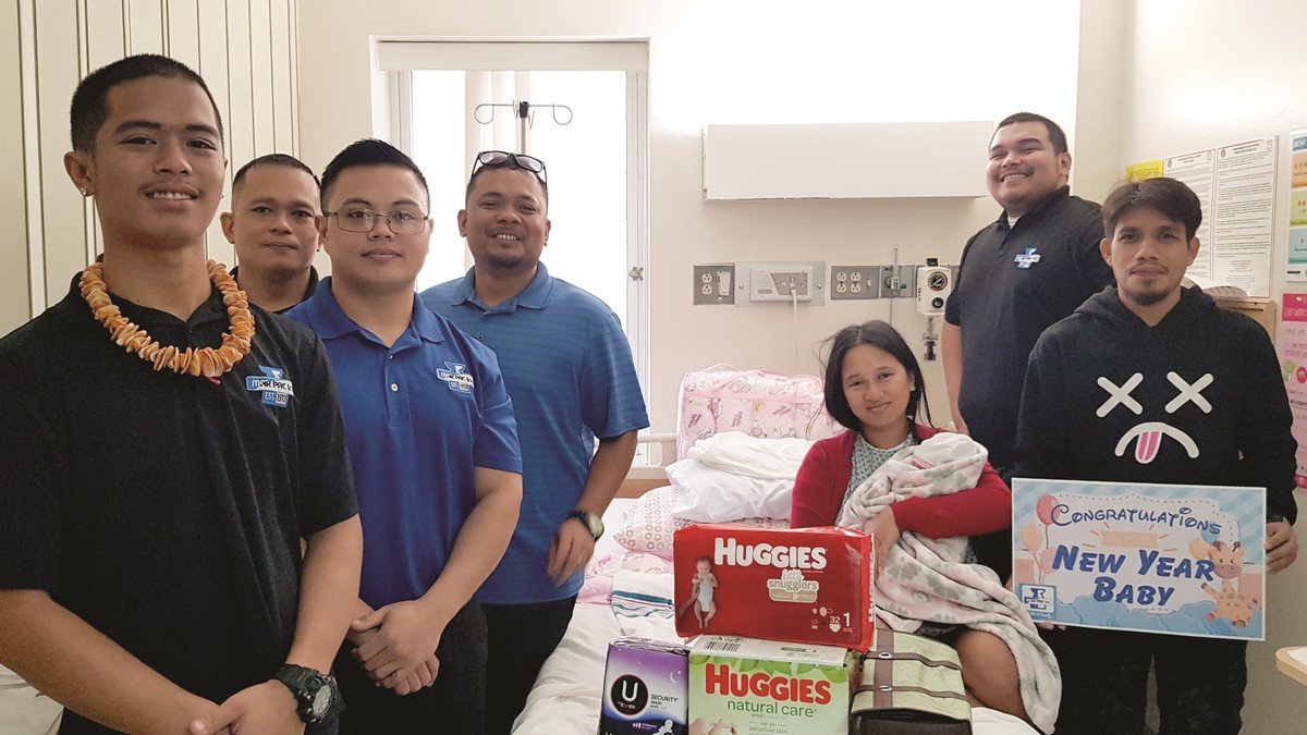 Marpac staff members visit the New Year baby, Margarette Cano, and her parents on Thursday at the hospital. In photo are baby Margarette, her parents Joanne and David Cano, Marpac staff members Eugene Mendez, Chris Nunez, Bradley Babauta, Tom Basa, and Francisco Macaranas. Photo by Lori Lyn C. Lirio