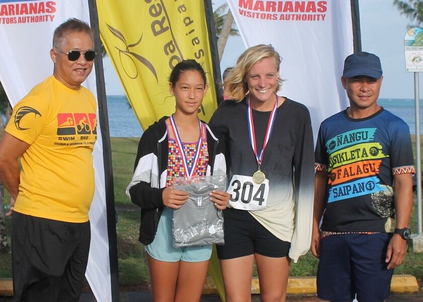 Sarah Vander Wal and Savita Sikkel  pose with TRAC representatives during the award ceremony of the 5th Aquathon & 10km Run at the Kilili Pavilion.