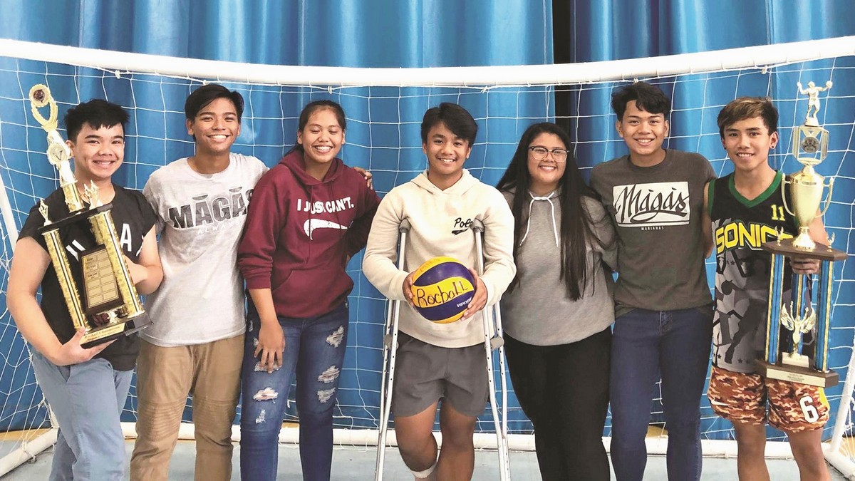 A high school student preps for the underhand serve during the opening of the Girls Rocball League at the MHS gym. Contributed photo