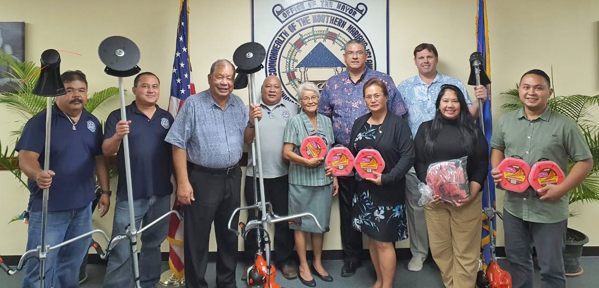Saipan Mayor David M. Apatang and his staff members pose with Rotary Club of Saipan members led by their president Marcia Ayuyu during the handover of five brush cutters that were donated by the club to the Saipan mayor’s office on Tuesday. Contributed photo