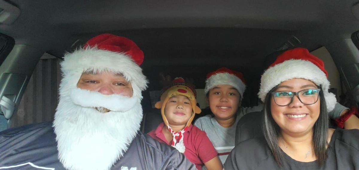 The Taitano family poses for a photo before delivering home-cooked meals to the homeless in Hagåtña and Tamuning on Dec. 25, 2019. Photo courtesy of the Taitano family