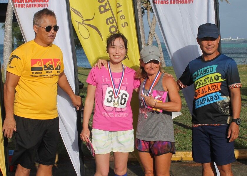 Maki Narita and Sarka Glanchova pose with TRAC representatives  during Sunday’s award ceremony of the 5th Aquathon & 10km Run at the Kilili Pavilion.