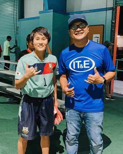 Kohana Ada, left, poses with Northern Mariana Islands Football Association executive committee member Norman Del Rosario at the TSL Sports Complex. Photo by James F. Sablan Jr. 