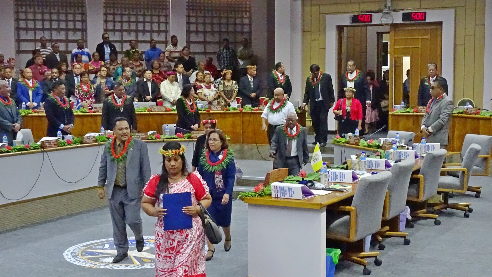 In this file photo from 2017, Marshall Islands President Hilda Heine, center black dress, enters the parliament chamber flanked by Speaker Kenneth Kedi for the start of a new session. Photo by Hilary Hosia