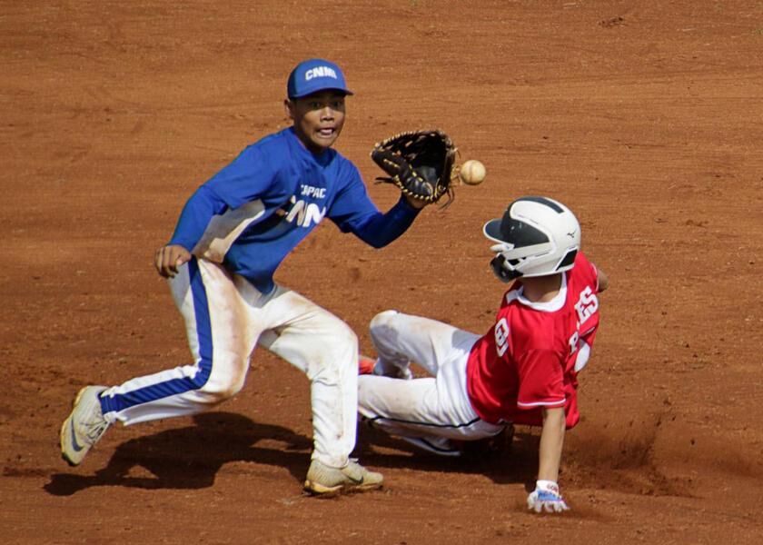 Team Guam’s Zhavier Panes beats a throw to second face during a World Baseball 15U Oceania Qualifier on Wednesday at Paseo Baseball Stadium in Hagåtña. Photo by Matt Weiss