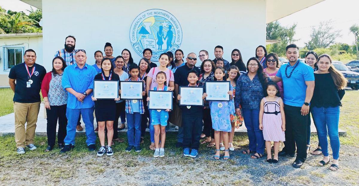 The Public School System’s Instructional Technology and Distance Education Program recognizes Anthony Deleon Guerrero of William S. Reyes Elementary School; Geelianan Deleon Guerrero, also of WSR; Jasmine Coleen Yalung of Sinapalo Elementary School on Rota; Jaedi L. Celis of Francisco M. Sablan Middle School; and Katherine Magat of Marianas High School for using technology to aid their learning and academic growth. An awarding ceremony was held at the education commissioner’s office on Capital Hill on Wednesday, March 4. In photo are the students, their parents, teachers, and PSS administrators and key management. Contributed photo
