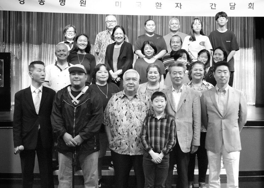 Kang Dong Orthopedic Hospital officials pose with CNMI officials and patients in the Hyatt ballroom. Photos by Emmanuel T. Erediano