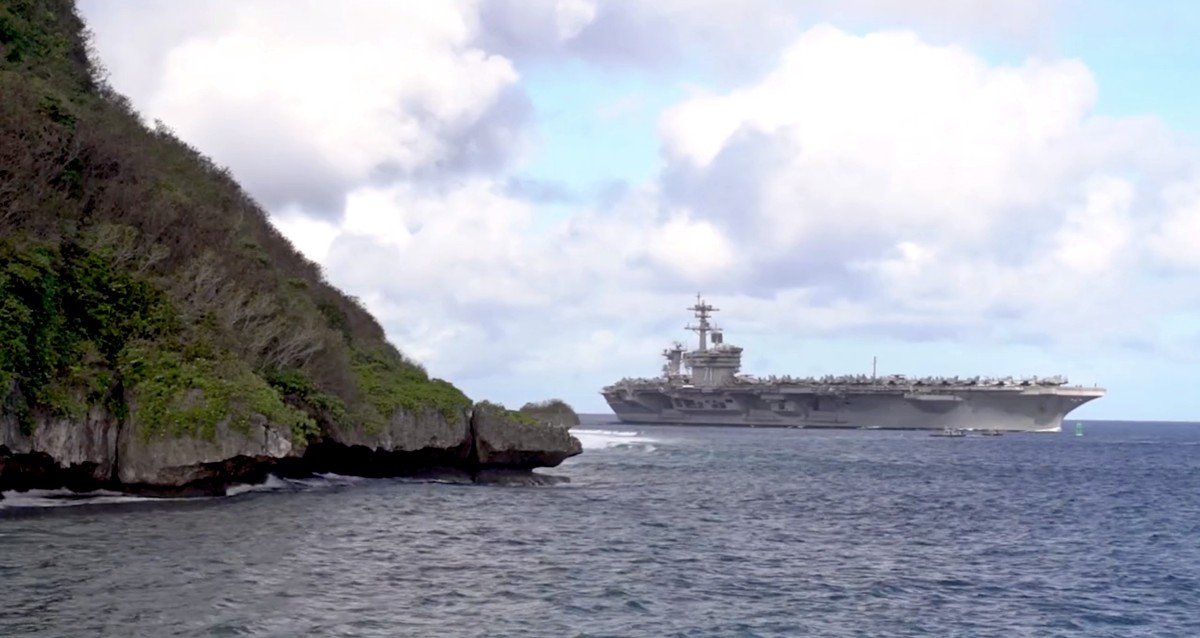 The Nimitz-class aircraft carrier USS Theodore Roosevelt transits Apra Harbor as it prepare to moor in Guam. U.S. Navy photo