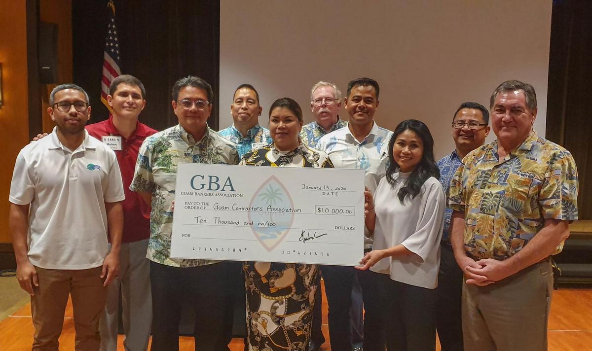 The Guam Bankers Association donated $10,000 to the Guam Contractors Association to assist in the lawsuit against the federal government over the stalled processing of H-2B visas. From left: Byron Evaristo, BankPacific; Camilo Lorenzo, GCA board member; Ed Untalan, First Hawaiian Bank; Mark Cruz, GCA board member; Jessica Barrett, GCA board chairperson; Peter Errett, GCA board member; Peter Valdez, ANZ Bank; Grace Jacot, GCA board member; Bill Bernardo, GCA board member; and Phil Flores, CEO and chairman of BankPacific and representative of the Guam Bankers Association. Photo by David Castro/The Guam Daily Post