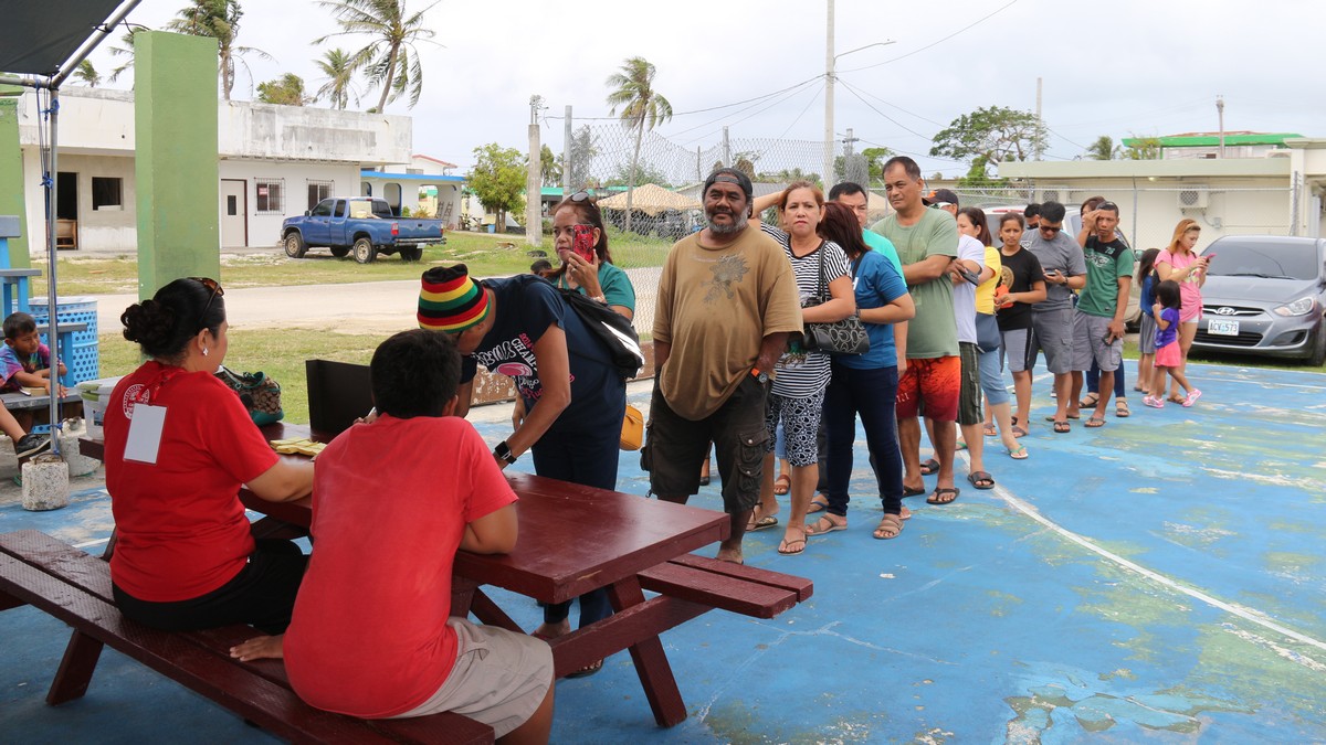 Community members line up to avail themselves of the free services offered at the Pentecostal Church of Christ-4th Watch medical outreach in San Antonio on Sunday.