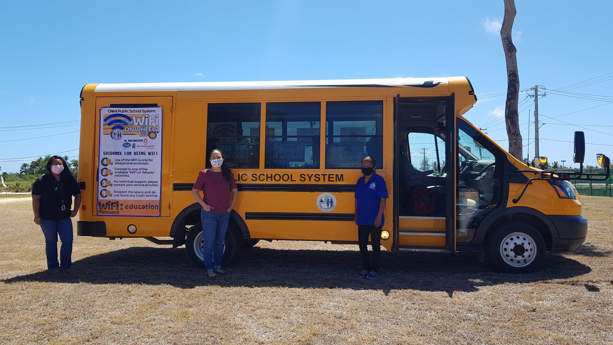 Saipan Mayor David M. Apatang and a staff member pose with the Korean students who are on island for the WOW English Camp. Photo by Junhan B. Todiño