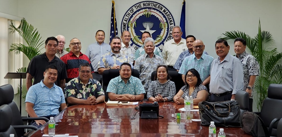 Gov. Ralph DLG Torres and Lt. Gov. Arnold I. Palacios pose for a photo with Attorney General Edward E. Manibusan, legislative leaders and education officials in the governor’s conference room on Wednesday. Office of the Governor photo