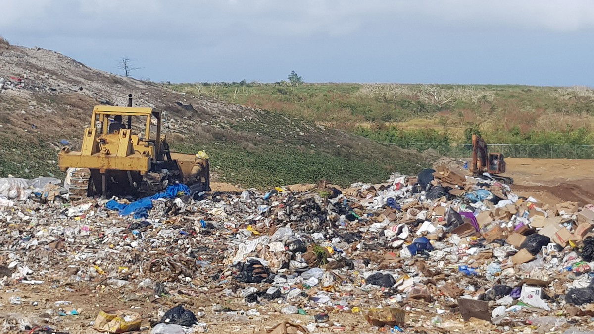 A bulldozer pushes trash at the Marpi landfill. Photo by Emmanuel T. Erediano