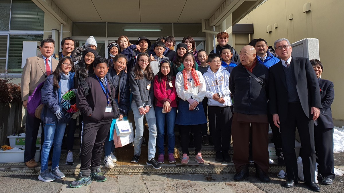 Saipan students and their chaperones led by special assistant to the mayor Henry Hofschneider pose at Joyama Elementary School in Japan during a welcome party in their honor.