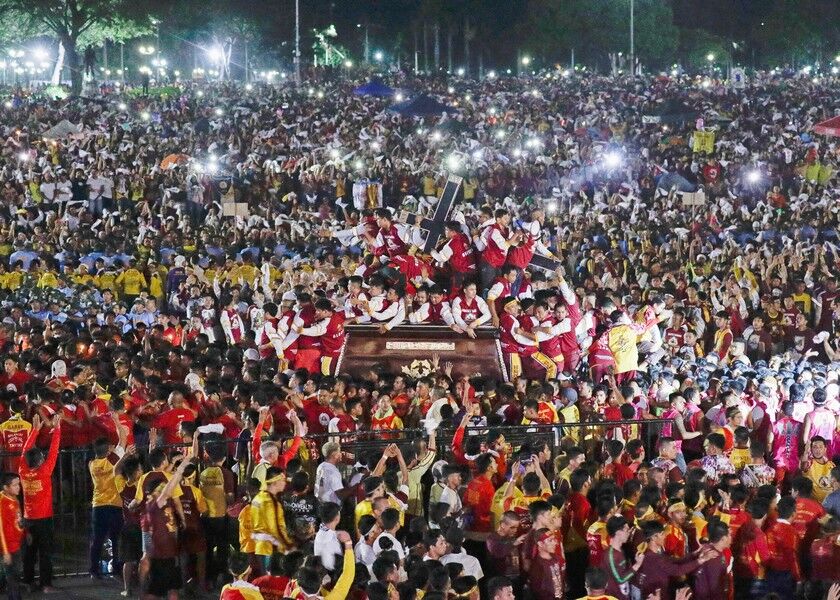 Devotees struggle to get close to the carriage of the Black Nazarene during a raucous procession to celebrate its feast day, Thursday, in Manila. A mammoth crowd of mostly barefoot Catholics prayed for peace in the increasingly volatile Middle East at the start Thursday of an annual procession of a centuries-old black statue of Jesus Christ in one of Asia’s biggest religious events. AP