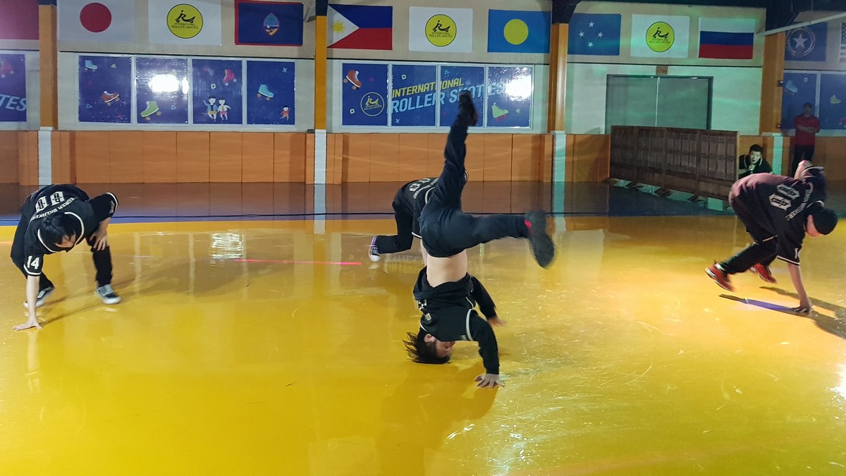 Korean breakdancers show their moves during the grand opening of International Roller Skates on Saturday at Winners Residence in San Antonio.