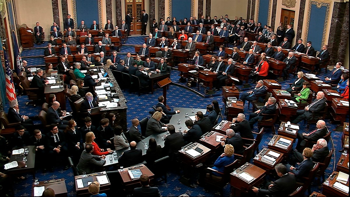 In this image from video, Sen. Mitt Romney, R-Utah, back row second from left, stands and cast a “guilty” vote on the first article of impeachment, abuse of power, during the impeachment trial against President Donald Trump in the Senate at the U.S. Capitol in Washington, Wednesday. AP