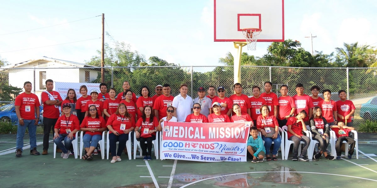 Pastor Claire Javillonar of the Pentecostal Church of Christ-4th Watch, other church members and volunteers pose for a photo during the medical mission in Gualo Rai on Sunday. Contributed photo