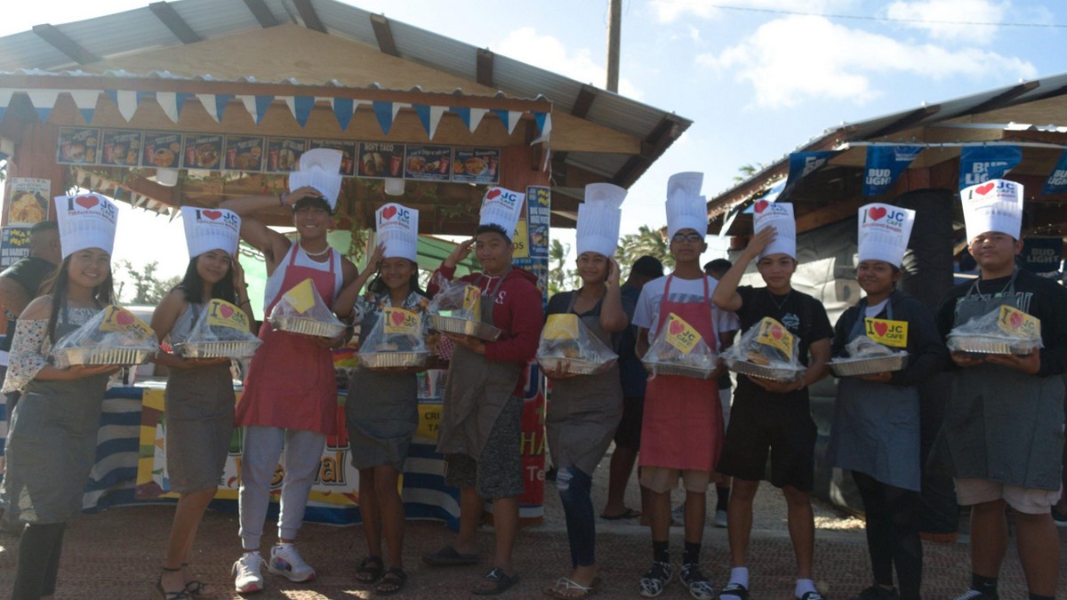 Tinian JROTC cadets volunteer to assist in the Spicy Burger Eating Contest. From left, C/CPL Chad Acollador, C/MAJ Keyla Flores, C/SSG Tyler Santos, C/CPT Charlene Danganan, C/CPL Gio Vergara, C/CPL Ciara Santos, C/1SG William Tudela, C/CPL Kylle Cruz, C/CSM Julia Biton, and C/SSG John Mark Palilio. JROTC Stallion Battalion photos