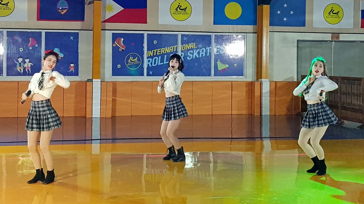 K-Pop group LikeMe performs a song and dance number during the grand opening of International Roller Skates on Saturday at Winners Residence in San Antonio.