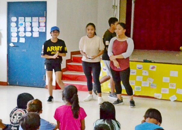 C/SGT Mary Manuel, C/PV2 Samantha Sandbergen, and C/CPL Angela Esteban explain each exercise station. Tinian JROTC Stallion Battalion photos