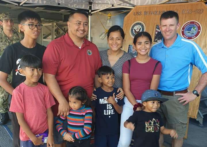 Gov. Ralph DLG Torres, first lady Diann T. Torres and their children pose for a photo with Capt. Kurt Sellerberg. Office of the Governor photos