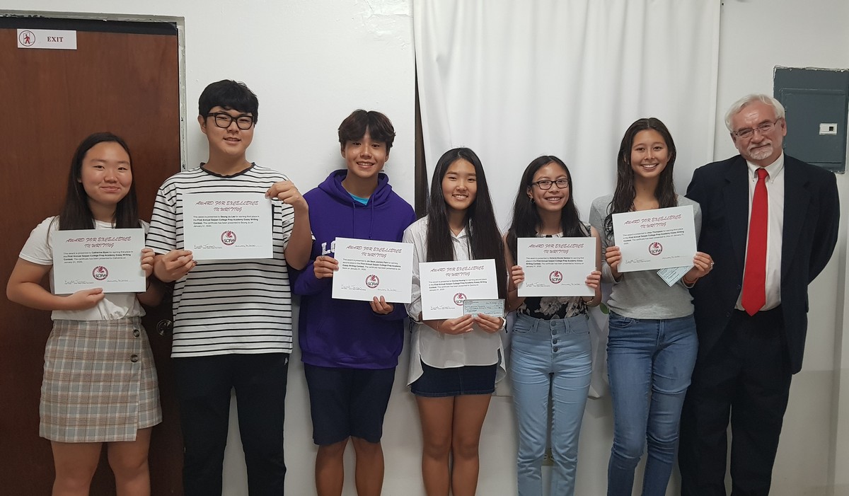 From left, Catherine Byen, Seung Ju Lee, James Park, Cevina Hwang, Victoria Nicole Santos, Jinju Thompson, and Saipan College Prep Academy essay instructor Keith Tessen. Photo by Lori Lyn C. Lirio