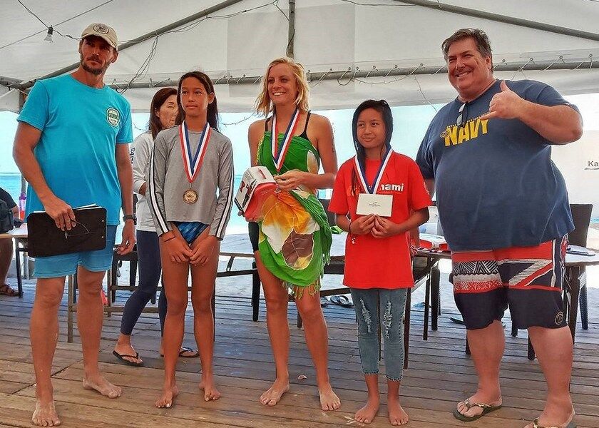 Maria Batallones, second right, poses with Sarah Vander Wal, Savita Sikkel and event organizers during the award ceremony of the 14th Meek & Mighty Ocean Swim at the Kanoa Resort beach on Feb. 15. 2020. Contributed photos