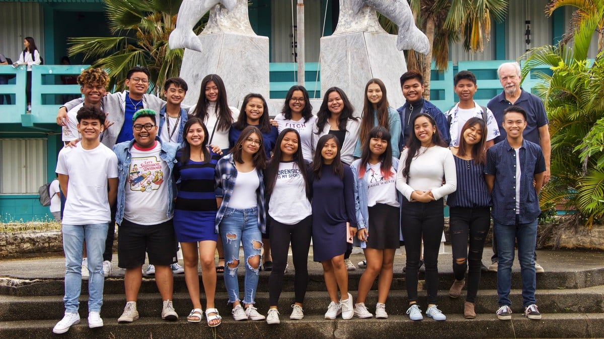 Members of the Marianas High School Rhythm ‘n Harmony Glee Club pose for a photo with their advisor Harold Easton. Contributed photo