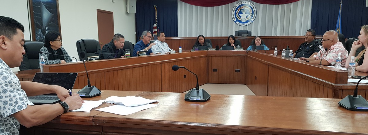 Senate Floor Leader Justo Quitugua, fourth left, speaks to Customs Director Jose Mafnas, second right, during the Senate Fiscal Affairs Committee meeting on Wednesday. Also in the picture are the committee chairman, Senate Vice President Jude Hofschneider, fifth left, Sen. Teresita Santos, second left, Sen. Vinnie Sablan, third left, Senate legal counsel Antoinette Villagomez, fourth right, Senate legislative assistants Jolyn Tagabuel and Alexis Hofschneider, Customs compliance officer Bob Reyes, third right, and Saipan Chamber of Commerce executive director Maxine Laszlo. Photo by Emmanuel T. Erediano