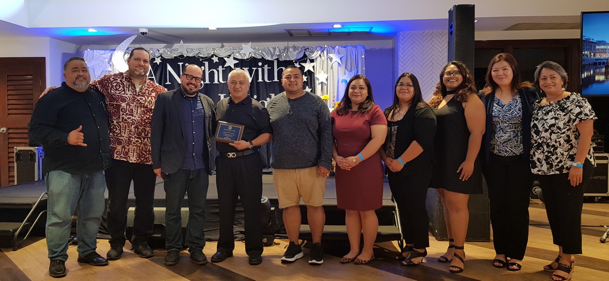 Mount Carmel School board chairman Ben Babauta, fourth left, is the 2020 AlumKnight of the Year. Also in photo are the other MCS board members, MCS president Dr. Galvin Deleon Guerrero, MCS AlumKnight Association officers and Babauta’s family. Photo by Lori Lyn C. Lirio