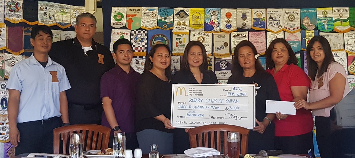 Rotary Club of Saipan officers led by their president Marcia Ayuyu, third right, receive a donation of $3,000 from McDonald’s Saipan. Photo by Junhan B. Todiño