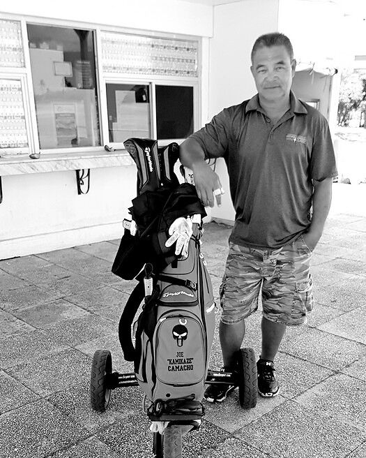 CNMI Golf Federation’s Joe Kamikaze Camacho stands next to a trolley that local golf players can use during the tryouts. Photo by Emmanuel T. Erediano