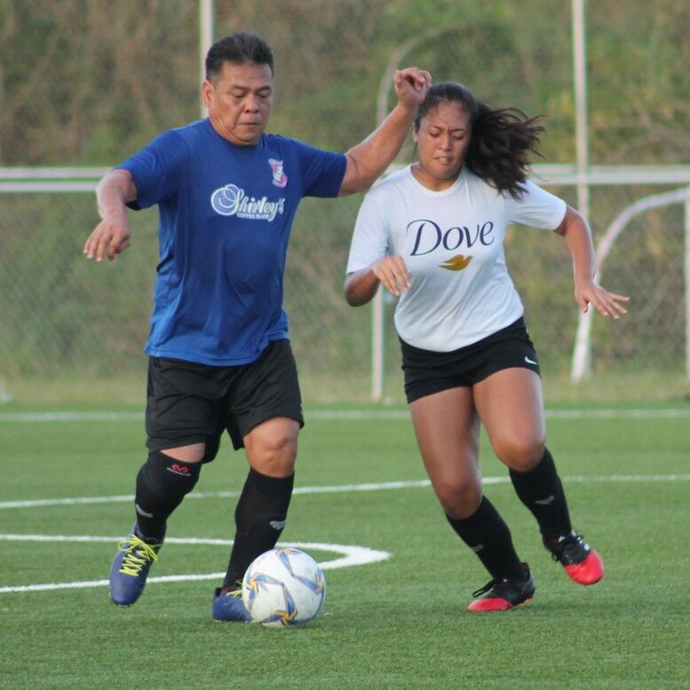 Shirley’s Ariel Jinang battles for the possession during a game in a previous season of the Men’s M-League at the NMI Soccer Training Center. Photo by James F. Sablan Jr.