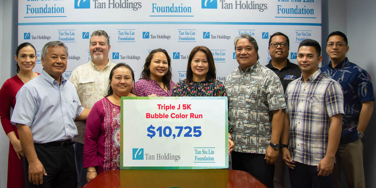 Triple J Enterprises vice president Mike Sablan, second left, joins other Triple J executives, Tan Siu Lin Foundation officials, led by executive director Merlie Tolentino, sixth left, and TanHoldings community relations director Carline Sablan, fifth left, in the TSLF’s donation turnover ceremony for Triple J 5K Bubble Color Run/Walk on Monday last week at the TanHoldings corporate office in Garapan. Contributed photo