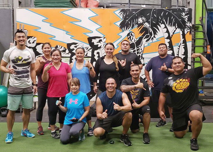 James Lee poses with his 5 a.m. class at Latte Built Gym. Contributed photos