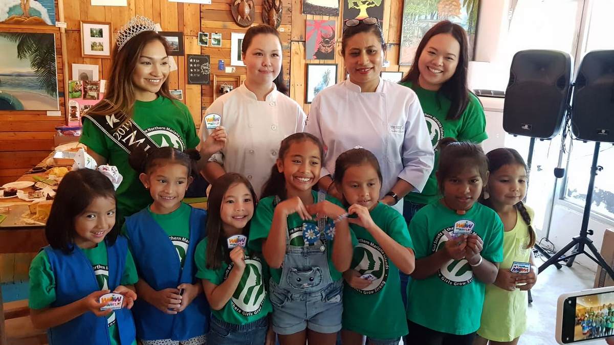 NMI Girl Scouts receive their cookies badges on Saturday after a bake-off challenge at Marianas Creation. Also in photo are troop leader 2019 Miss Marianas Shannon Sasamoto, Hyatt Regency Saipan pastry chef Mahala Wister, Everest Kitchen owner Laxmi Shrestha, and NMI Girl Scouts cookie manager Michelle Sablan. Photos by Lori Lyn C. Lirio