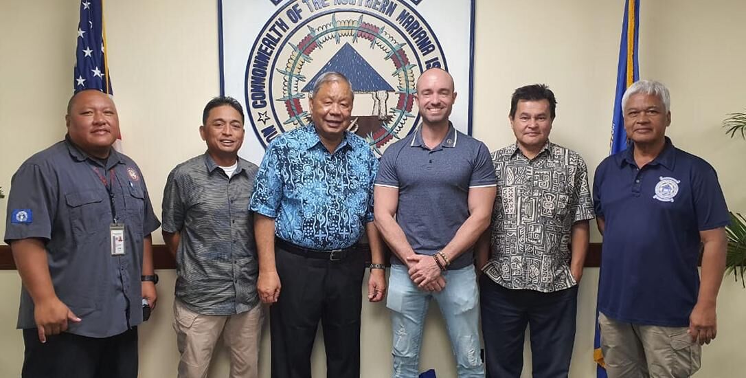Saipan Mayor David M. Apatang, third left, poses with Marcus Landon Aydlett, fourth left, of the National Weather Service on Guam, the mayor’s staffers and officials of Homeland Security and Emergency Management. Contributed photo