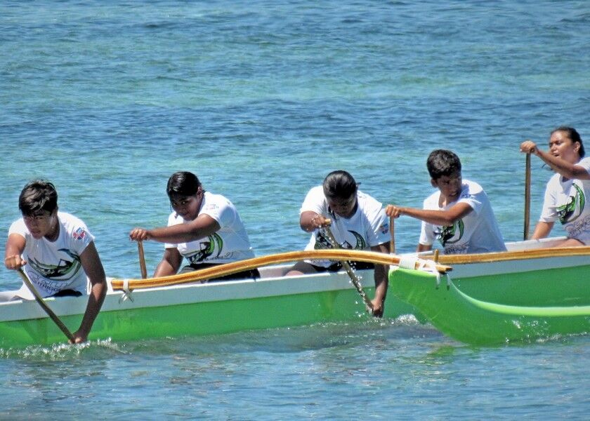 Saipan Southern High School pushes to cross the finish line in the 1000m race on Saturday in the of the mixed division of the 2020 PSS Interscholastic Outrigger Canoe race at Kilili Beach, Oleai. Photo by Prince Factor