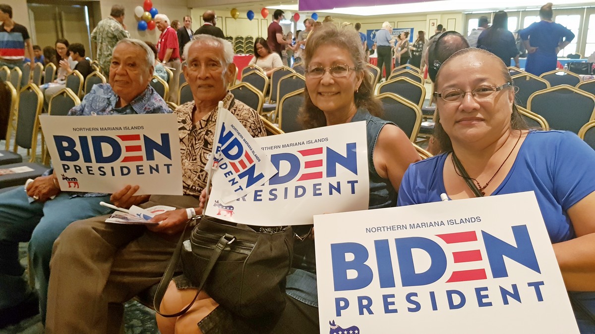 Former CNMI Gov. Carlos Camacho, second left, wife, Winnie, second right, former Saipan Mayor Jose Sablan, left, and local businesswoman Carmen Cabrera, right, hold signs to express support for former Vice President Joe Biden. Photos by Emmanuel T. Erediano