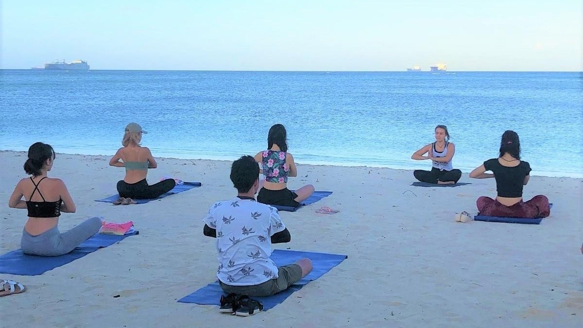 Young moviemakers and popular Instagrammers from Japan practice yoga on the beach in the Marianas on Feb. 16, 2020 as part of the Creators Camp in Saipan organized by the Marianas Visitors Authority and Tabippo.net. MVA photos