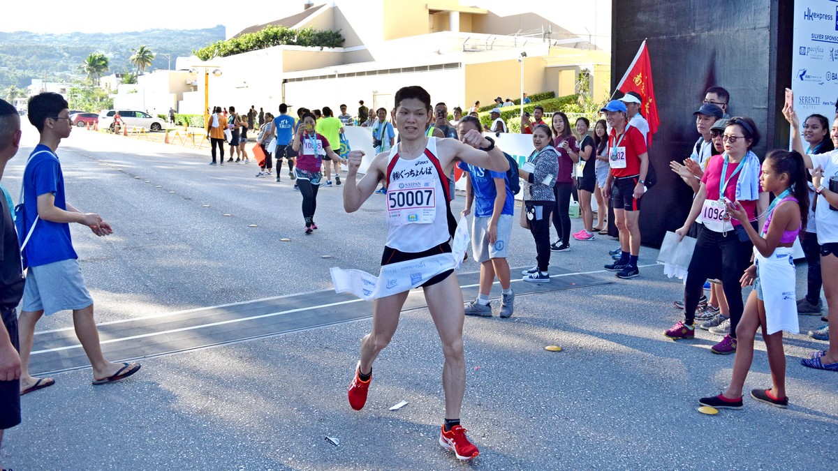 Japan’s Noriyasu Oda crosses the finish line in the 2018 Saipan Marathon at Micro Beach. Photo by Emmanuel T. Erediano