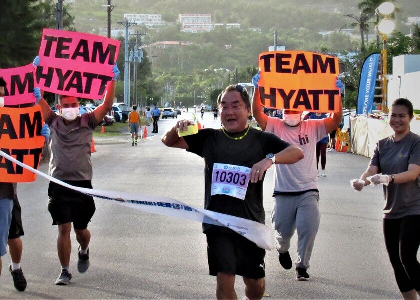 Hyatt general manager Nick Nishikawa completes the Saipan Marathon 5k run on Saturday at Micro Beach. Photo by Prince Factor
