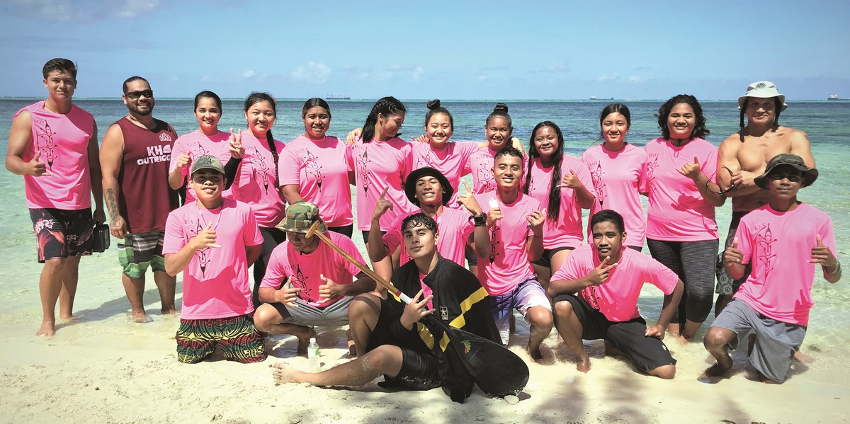 Members of the Kagman High School paddling team pose for a photo after the PSS Interscholastic High School Outrigger Canoe Race on Saturday at Kilili Beach in Oleai. Photo by Prince Factor