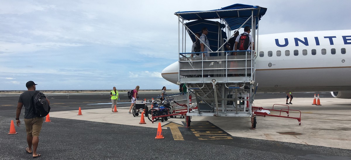 The Marshall Islands on Friday indefinitely banned all overseas travel by government employees and elected leaders in an effort to reduce opportunities for the importation of the new coronavirus. Photo shows passengers boarding a United Airlines flight in Majuro. Photo by Giff Johnson