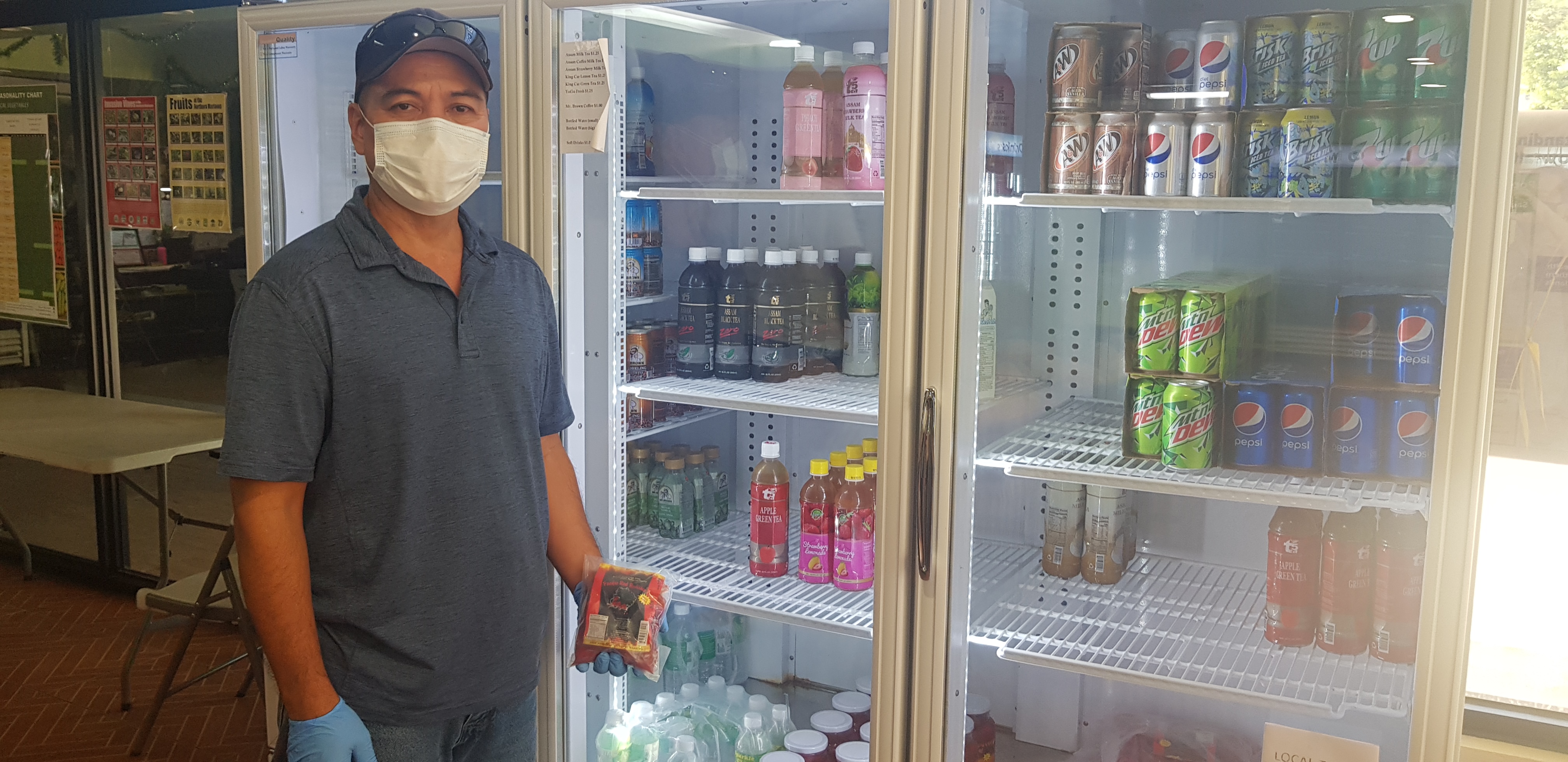 Leroy Pangelinan, Garapan Public Market manager, shows the grapefruit available at the store. Photo by Junhan B. Todiño