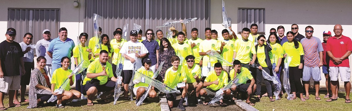 Saipan Fisherman’s Association’s “Tasi to Table” Youth Fishing Club members receive rod and reel combos as well as t-shirts from Saipan Fish & Tackle and Sporting Goods on Saturday at the Head Start Program office on Capital Hill. With the students in the photo are their advisors, Katherine and Pierre Lam owners of Saipan Fish & Tackle, Gov. Ralph Torres and SFA members. Photo by Bryan Manabat