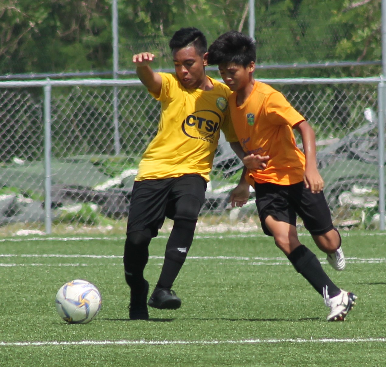Kanoa Football Club's Jim Maniago battles for the possession against a Matansa defender during a Youth League Fall 2019-U15 boys division game at the NMI Soccer Training Center in Koblerville.Photo by James F. Sablan Jr.